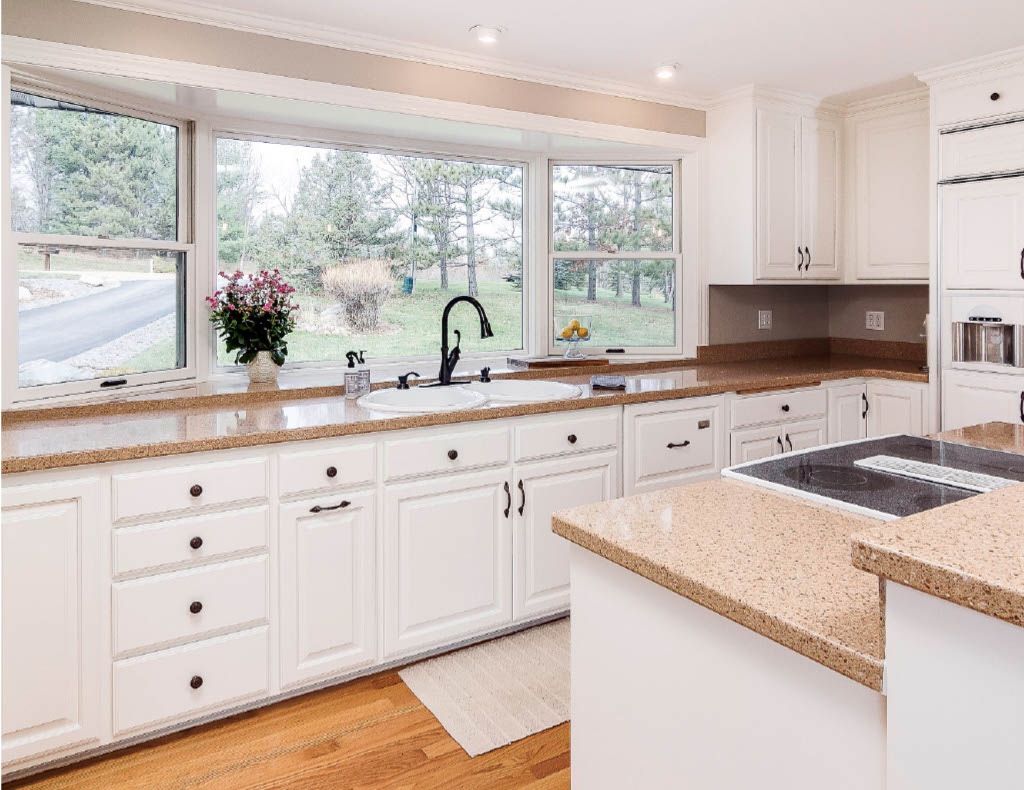 Newly painted kitchen cabinets with smooth spray finish