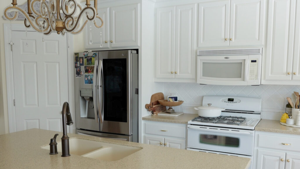 Professionally painted kitchen cabinets with smooth spray finish